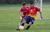 Juan Velazquez of FC Tuxpan just too fast for Eddie Lopez of Tortorella Pools