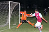 Jefferson Ramirez of Maidstone Market scoring on Antonio Chavez of FC Tuxpan
