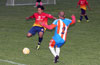 Nettie Sanchez of Tuxpan(left) and Alfredo Negrete of The Hideaway going for the ball
