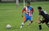 Cristian Bautista of The Hideaway(left) about to receive the ball as a Hampton FC defender looks on