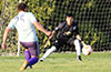David Amaya of FC Tuxpan(#25) taking a shot at Victor Velasquez of Sag Harbor