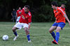 Daniel Chavez of Sag Harbor holding the ball away from Juan Fuquen of EH Soccer Fever