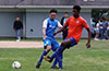 Mouhamadou Gaye(right) of EH Soccer Fever hitting the ball past Stiven Orrego of Tortorella Pools
