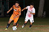 Donald Martinez of FC Tuxpan(left) about to out run Lenis Vera of FC Palora