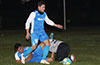 Playing on the ground as Eddie Lopez of Tortorella Pools is about to blast the ball up field