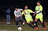 William Solia of East Hampton(left) holding off Nick Escalante(center) and Jose Almansa of Maidstone