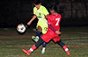 Jorge Naula of Maidstone(rear) hitting the ball past Jeremias Simon of Sag Harbor