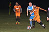 Jose Morastitla of FC Tuxpan(front) about to get by Leslie Czeladko of Tortorella Pools