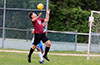Mark Bako of East Hampton trapping the ball in front of Cristian Munoz of Tortorella Pools