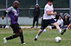 Malher Baldrich of Maidstone Market(left) blasting the ball past a Liga de Gulag defender