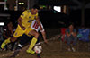 Jorge Neito of FC Tuxpan jumping over the sprinklers